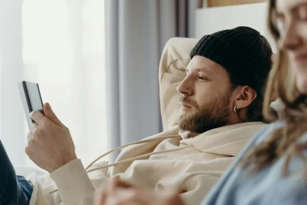 Man relaxing on sofa during weekend break