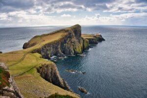 Offbeat Coastal Escapes in Spain: aerial view of a secluded Spanish cove with cliffs and turquoise water