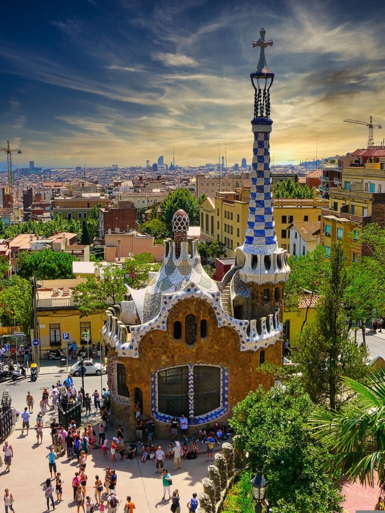 Solo traveler watching sunset over Barcelona cityscape