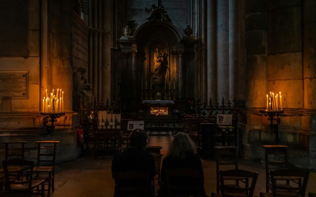 Spanish village festival experience with candlelight and singing.